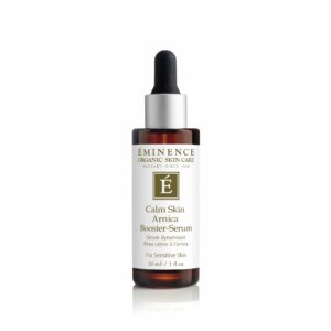 A bottle of Eminence Organics Calm Skin Arnica Booster-Serum on a white background.