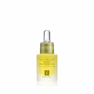 A bottle of Eminence Organics Facial Recovery Oil on a white background.