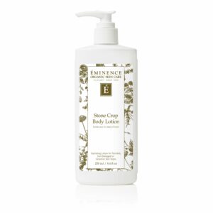 A bottle of Eminence Organics Stone Crop Body Lotion with a white background.