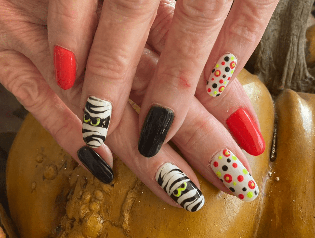 A close up of some nails with different designs