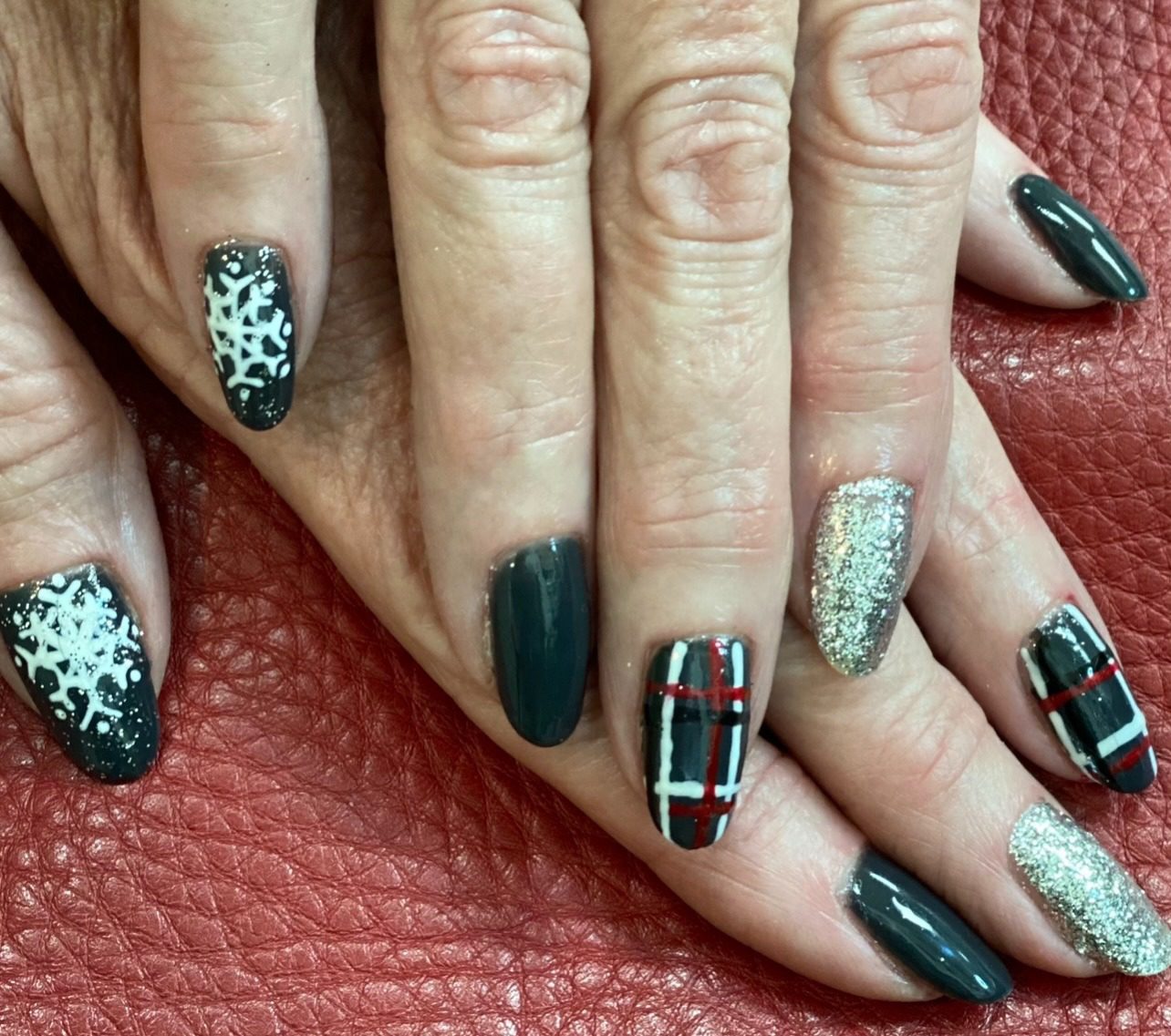 A close up of some nails with different designs