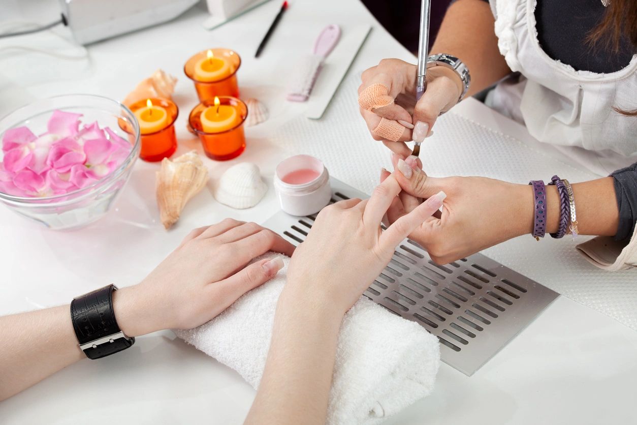 Beautician applying gel Rivé Nail + Skin Care Spa