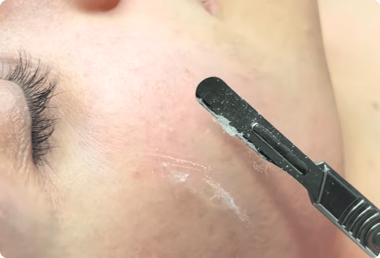 A person with a black brush in their mouth.